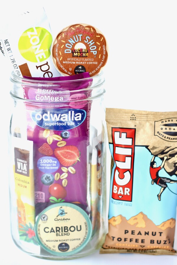 Coffee, food, and other items in a glass jar.