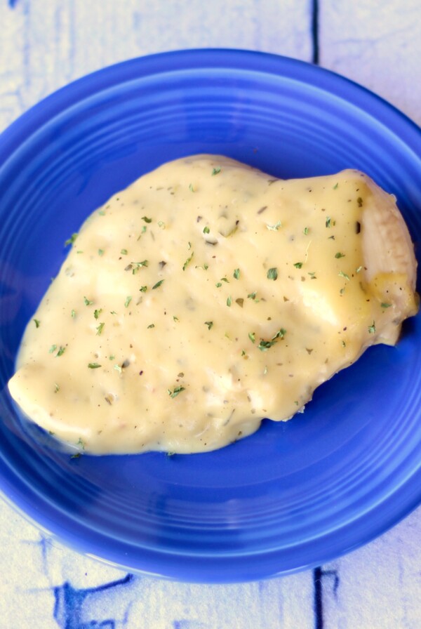 Creamy Ranch Chicken breast on a blue plate.