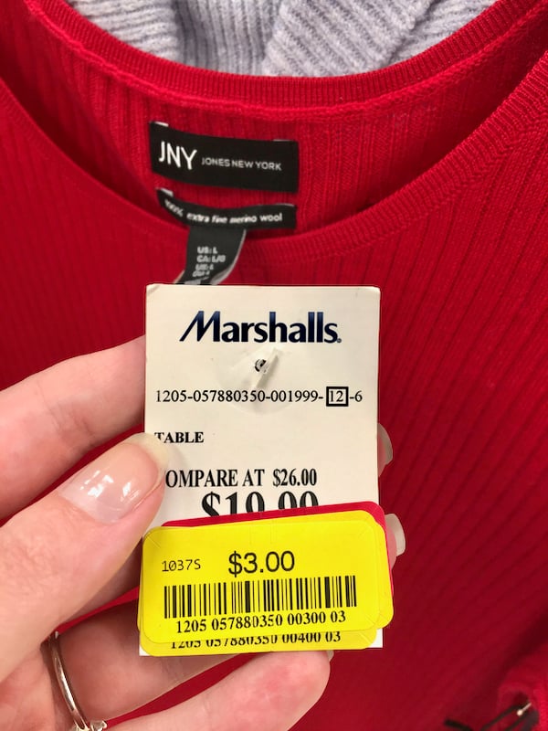 Sweater on clearance at Marshalls with yellow price tag.