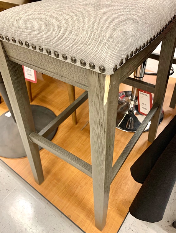 Damaged barstool leg at TJ Maxx.