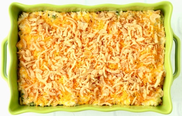 Cooked broccoli cheese casserole in 9x13 baking dish.