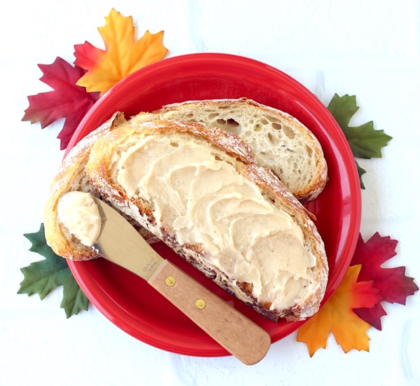 Slice of bread spread with maple butter.