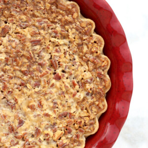 Chocolate Pecan Pie in a red dish.