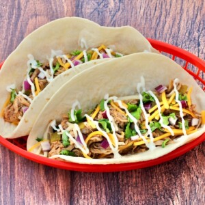 Pulled Pork Tacos in a red basket.