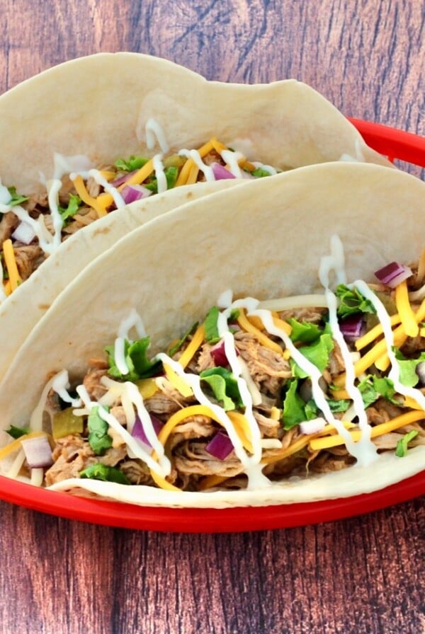 Pulled Pork Tacos in a red basket.