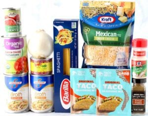 Tacos Spaghetti ingredients including broth, taco seasoning, and Mexican cheese.