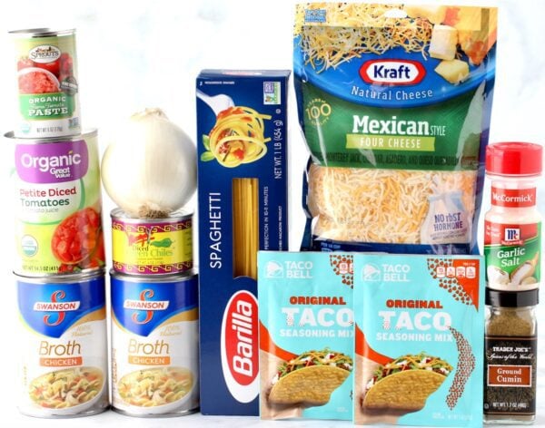 Tacos Spaghetti ingredients including broth, taco seasoning, and Mexican cheese.