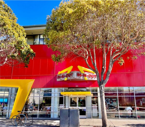 Trees in front of an In n Out Burger.