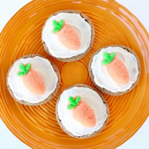 Four Carrot Cake Cookies  on a round, orange plate.