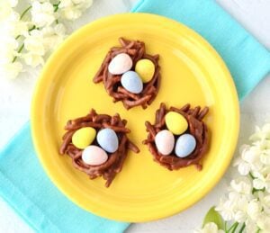 Three Easter Cookies on a yellow plate.
