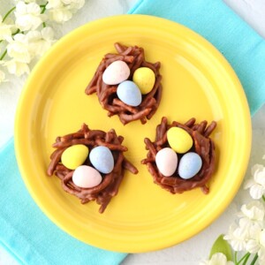 Three Easter Cookies on a yellow plate.