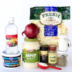 Coleslaw ingredients including mayo, sour cream, and vinegar.