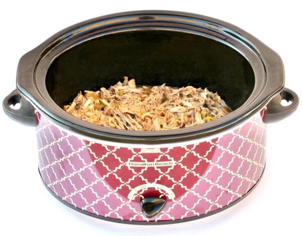 Pulled Pork meat in a slow cooker.