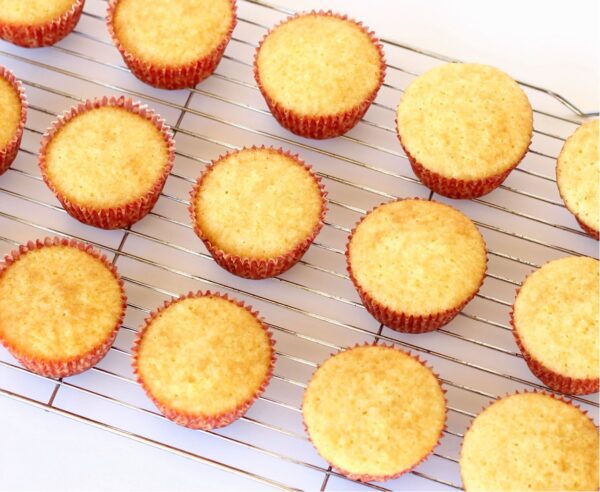 Cornbread muffins on a cooling rack.