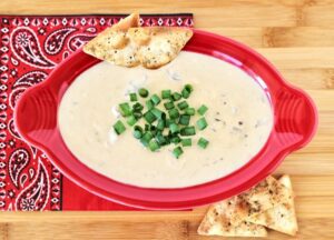 Red bowl of French onion dip.