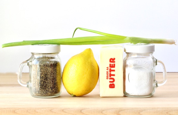 Grilled tilapia ingredients including butter, a lemon, and salt and pepper.