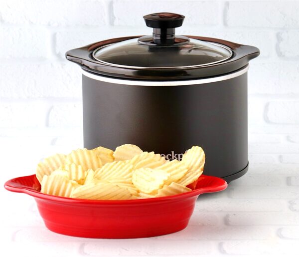 Potato chips in dish in front of mini crockpot with onion dip.