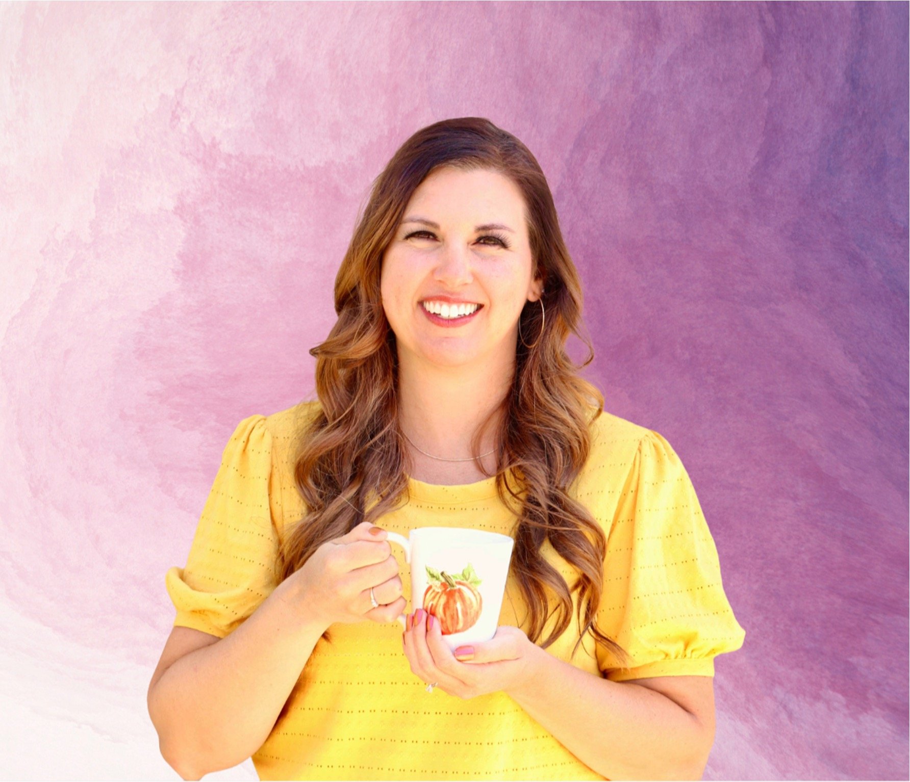 Heidi holding coffee mug.