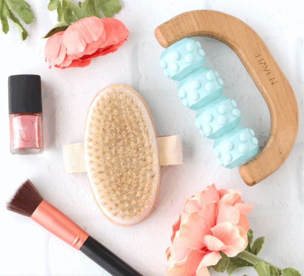 Beauty care products including makeup brush, roller, and skin brush.