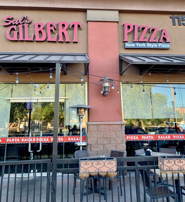 A Sal\'s Gilbert Pizza sign outside the restaurant.