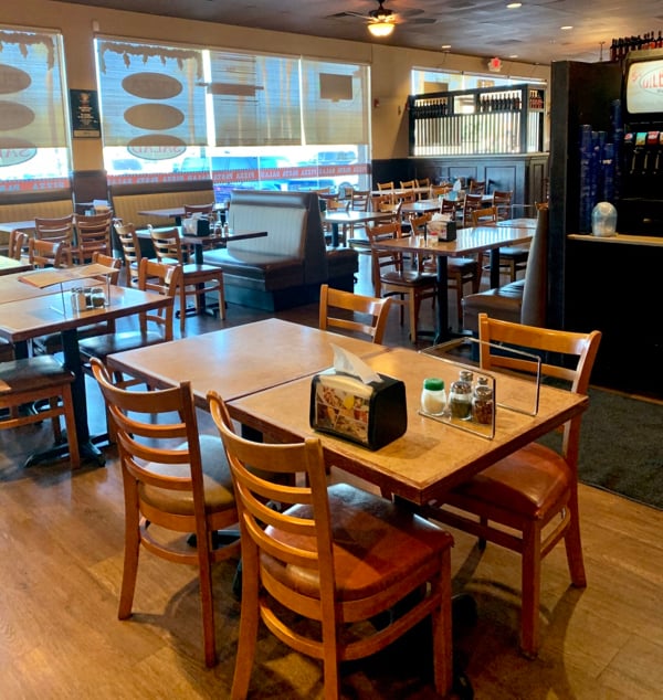 Tables and booths inside a restaurant.