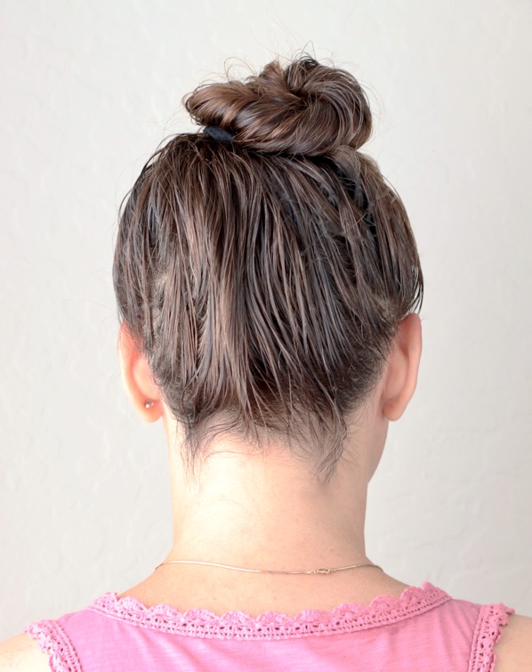 Woman with her hair in a bun.