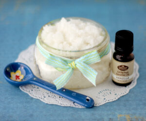 Coconut oil sugar scrub in a small jar.