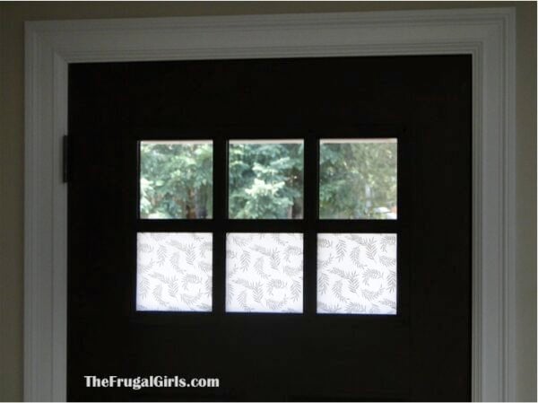 Window panes in a door, some of which are frosted.