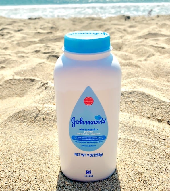 Baby powder in sand at beach.
