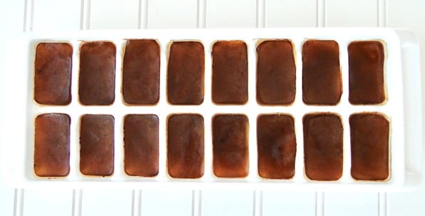 Frozen coffee cubes in ice cube tray.