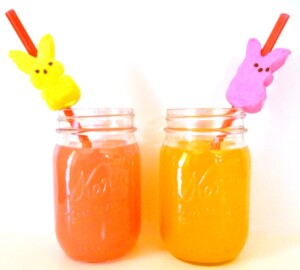 Mason jars with fruit punch and peeps straws.