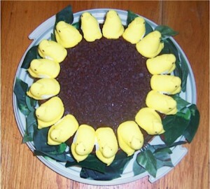 Baked cake with Peeps around border.