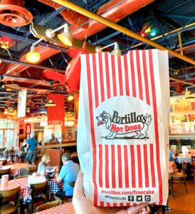 Portillo\'s Hot Dogs Bag inside restaurant.