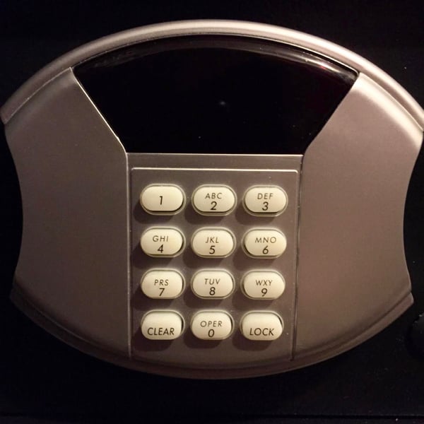 Buttons on front of safe.