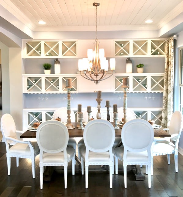 Dining room with table, chairs, and chandelier.