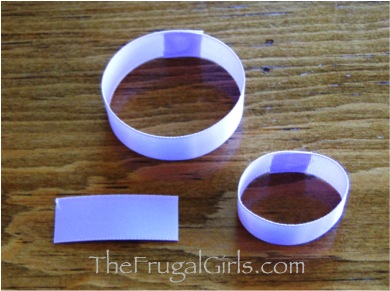 Two pieces of lavender ribbon glued into loops.