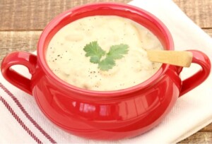 Bowl of white chicken chili with spoon.