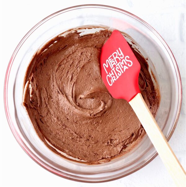 Chocolate cookie dough with Christmas spatula.