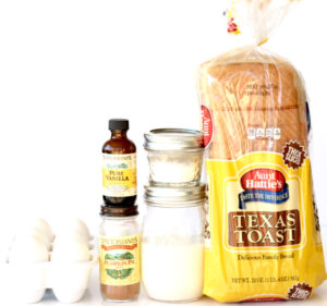 Ingredients for French toast arranged neatly in a line.