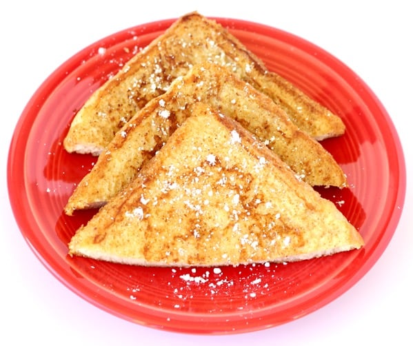 French Toast neatly arranged on a red plate.