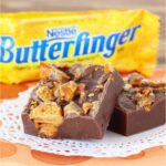 Two pieces of chocolate Butterfinger fudge on doily.