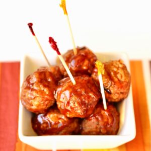 BBQ Meatballs in small dish with toothpicks inserted.