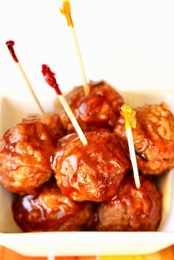 BBQ Meatballs in small dish with toothpicks inserted.