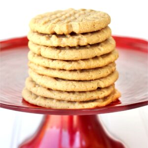 Stack of soft and chewy peanut butter cookies on stand.
