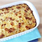 Bacon egg and cheese breakfast hashbrowns casserole in casserole dish.