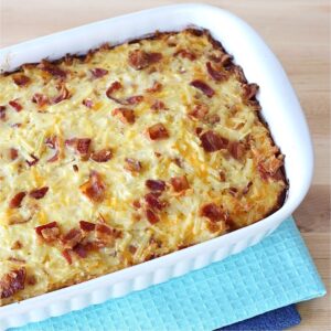 Bacon egg and cheese breakfast hashbrowns casserole in casserole dish.