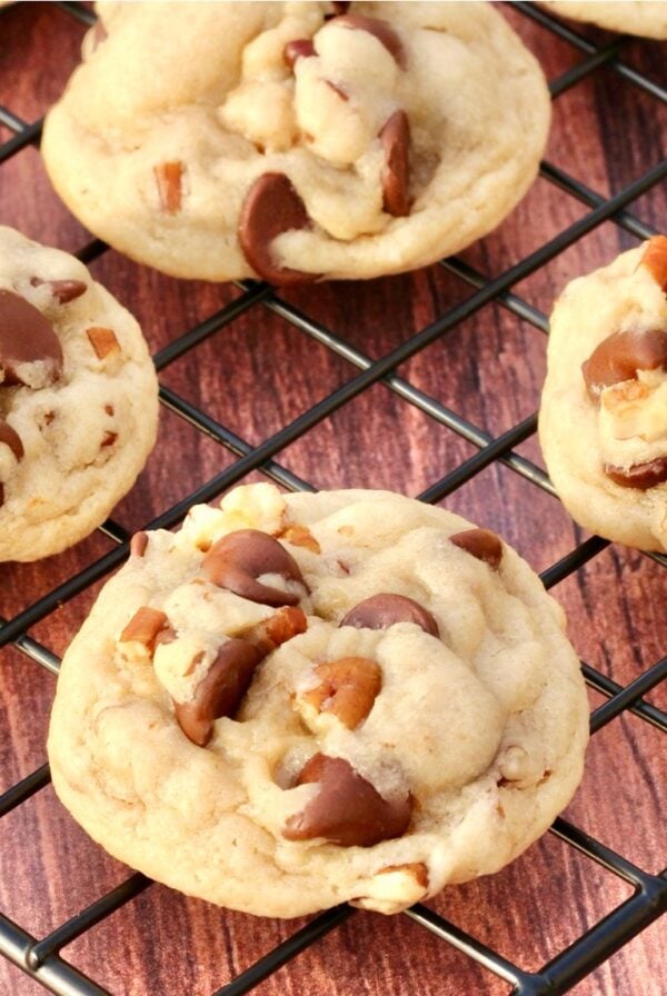 Chocolate chip pecan cookies cooling on wire rack.
