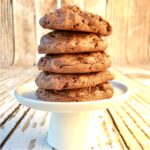 Stack of five chocolate crunch cookies on cookie stand.