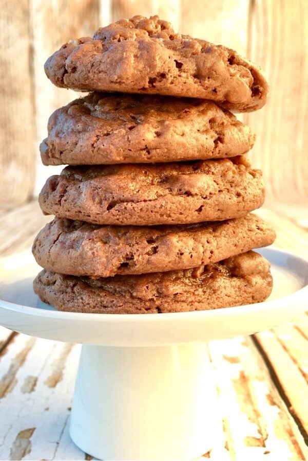 Stack of five chocolate crunch cookies on cookie stand.