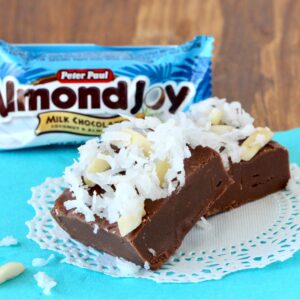 Two pieces of chocolate coconut fudge on doily.